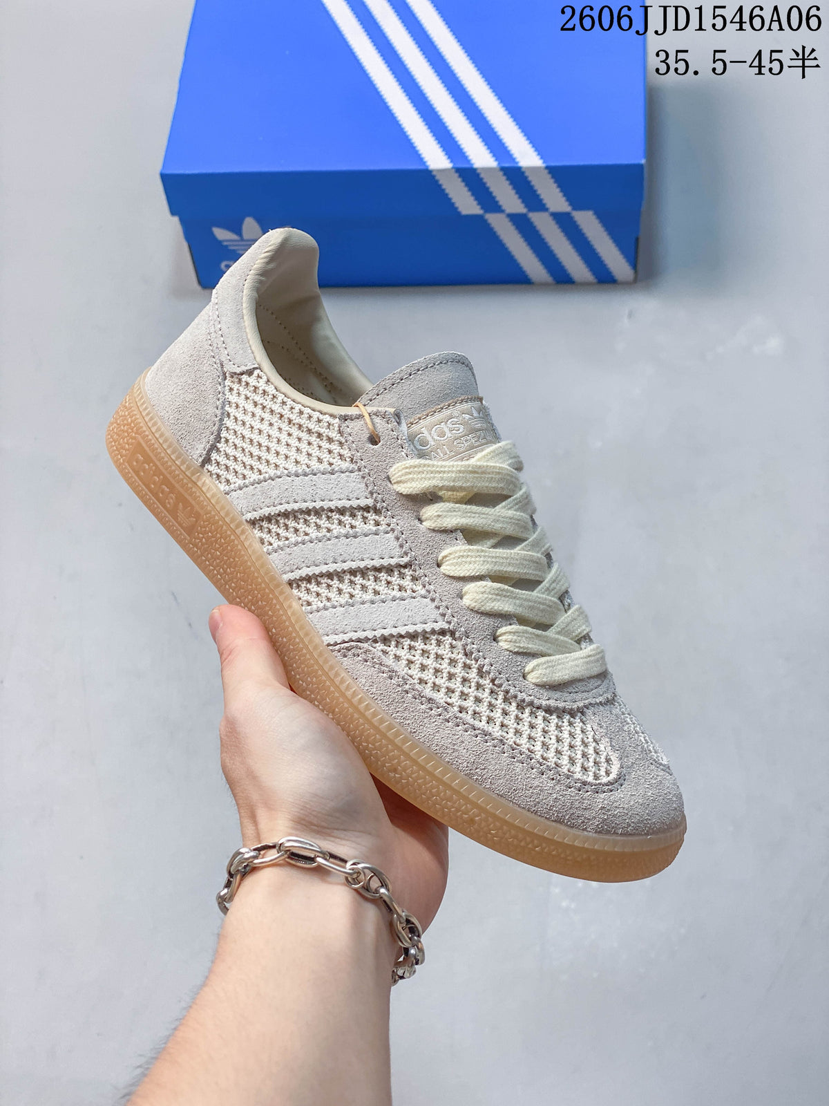 Angled side view of the light grey sneaker with gum-colored outsole