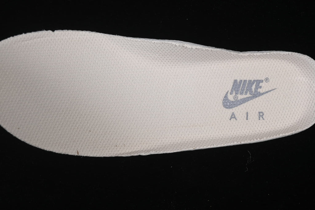 Close-up of a light-colored insole with Nike Air branding