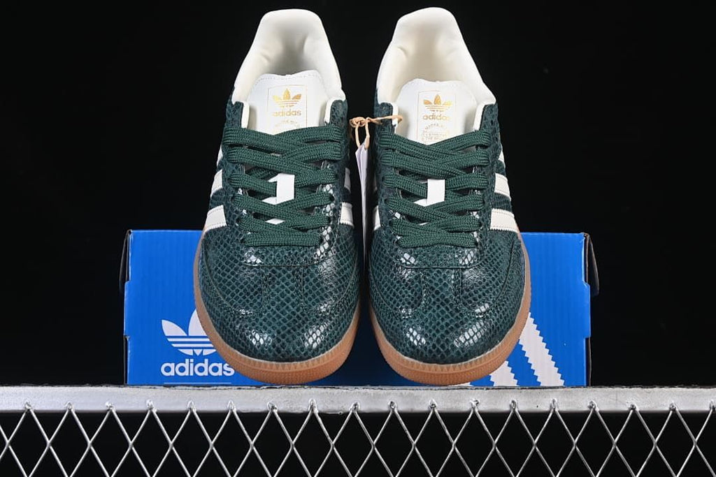 Front view of the pair showing the textured green toe boxes and laces
