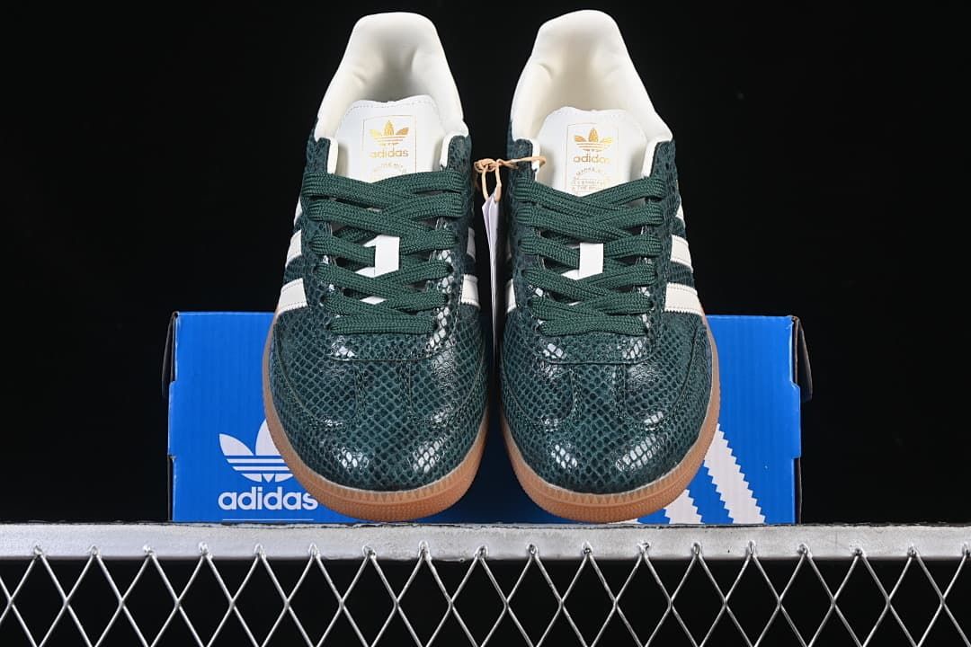 Front view of the pair showing the textured green toe boxes and laces