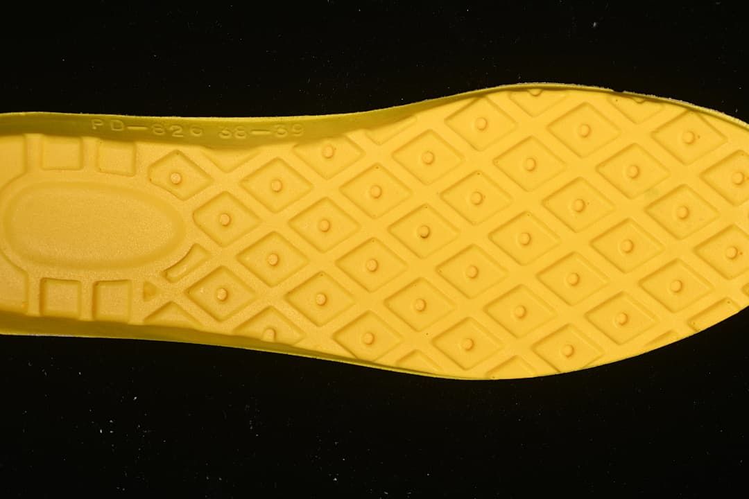 Close-up of the boot's yellow patterned outsole