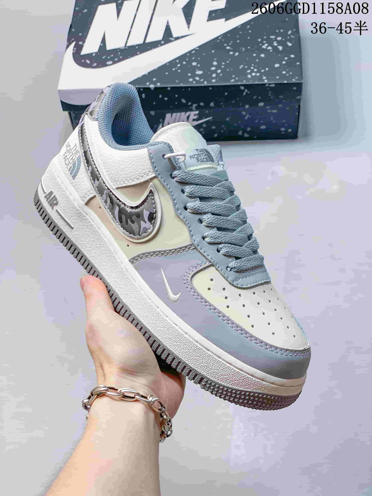 Angled close-up of the sneaker's side, laces, and patterned accent