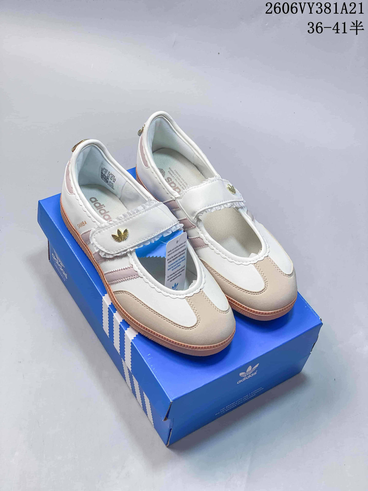 Pair of white and beige Adidas Samba Jane Mary Jane sneakers with pink accents and gum soles