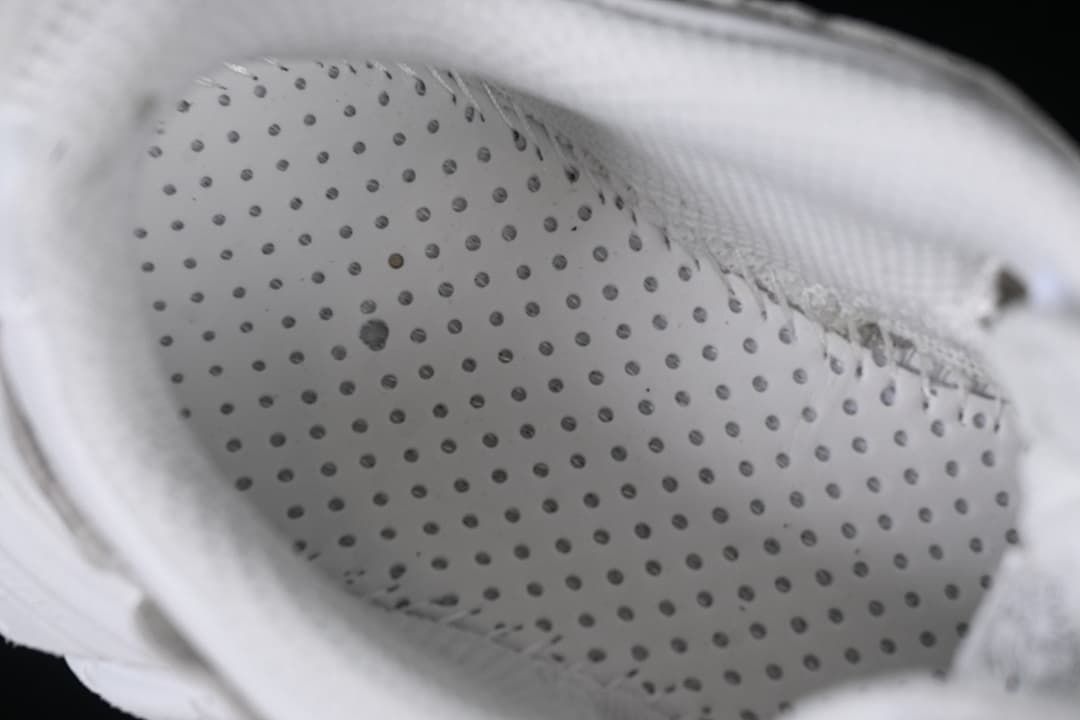 Close-up of perforated inner shoe material