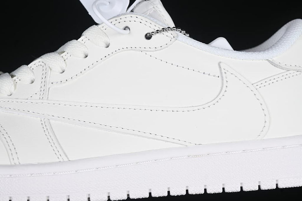 Close-up of the white side Swoosh, stitching, and lace charm.