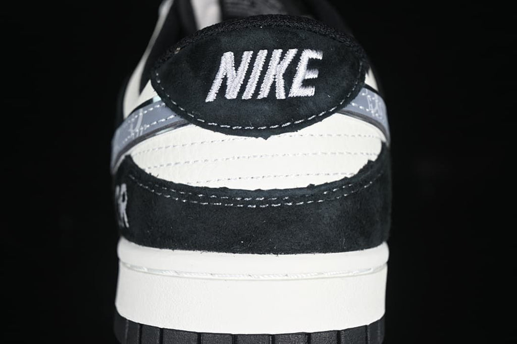 Rear view of the sneaker showing the heel tab, layered panels, and white midsole.