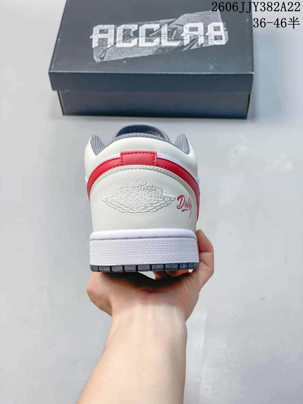 Rear view showing the heel panel, red heel accent, and grey collar lining