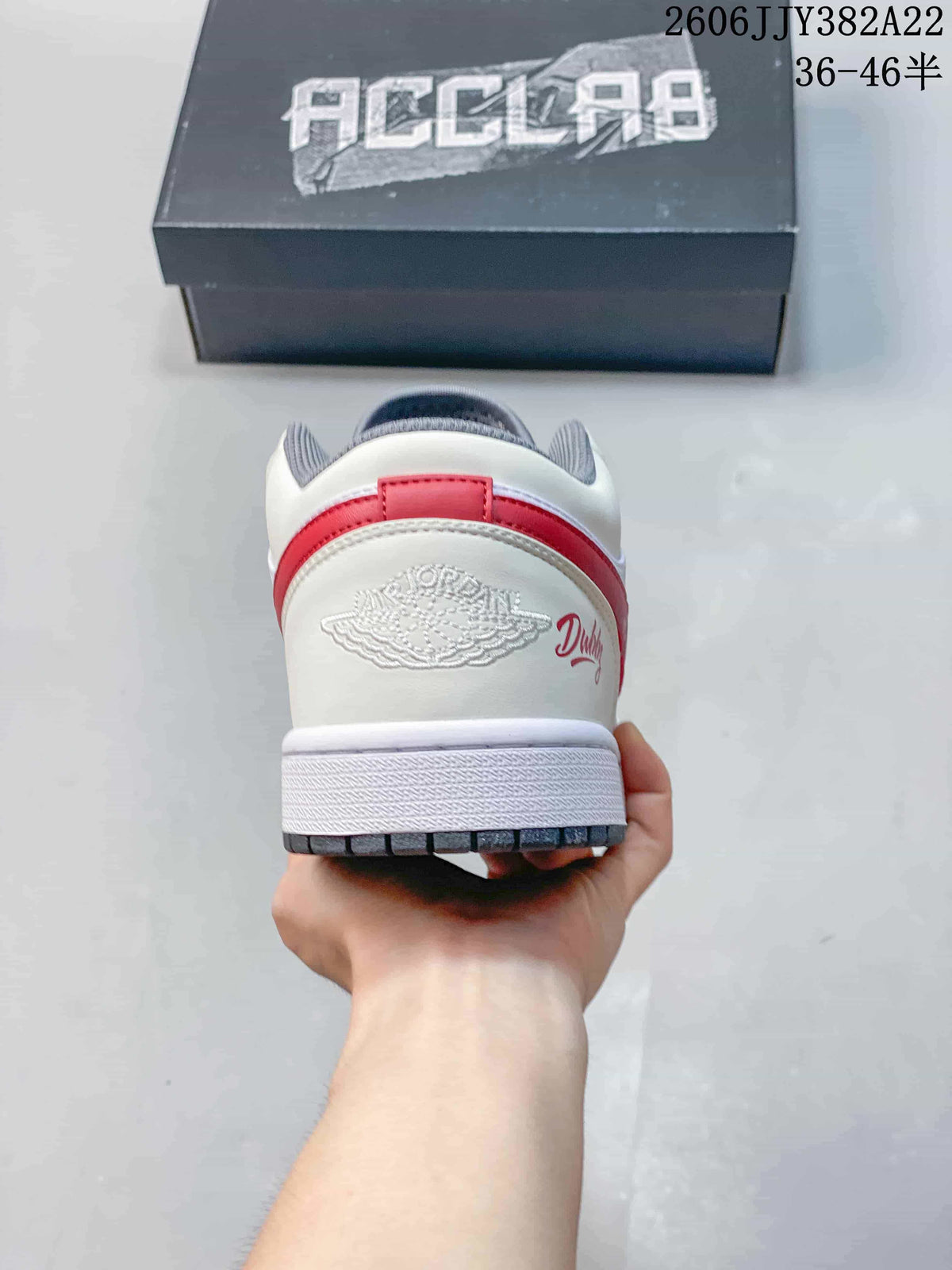 Rear view showing the heel panel, red heel accent, and grey collar lining