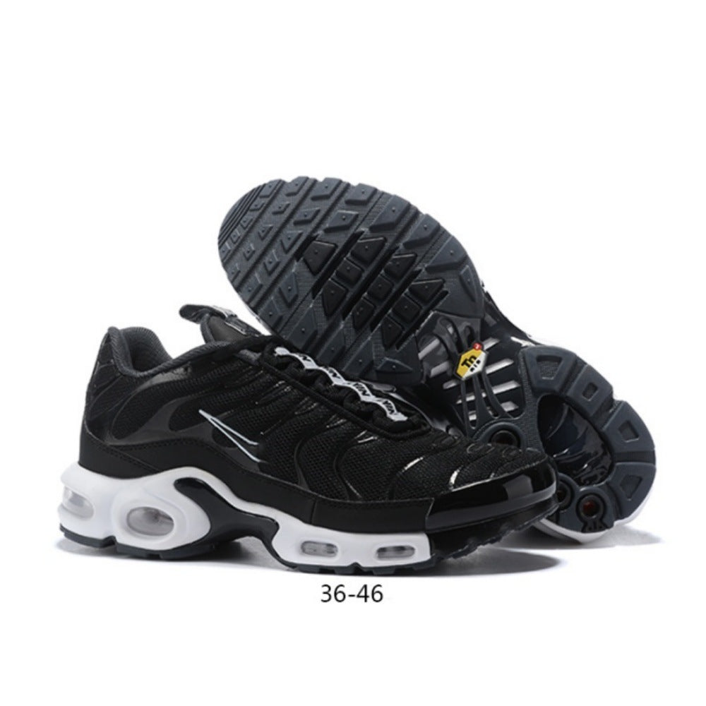 Black Nike Air Max Plus-style sneakers with a white midsole and visible cushioning windows.