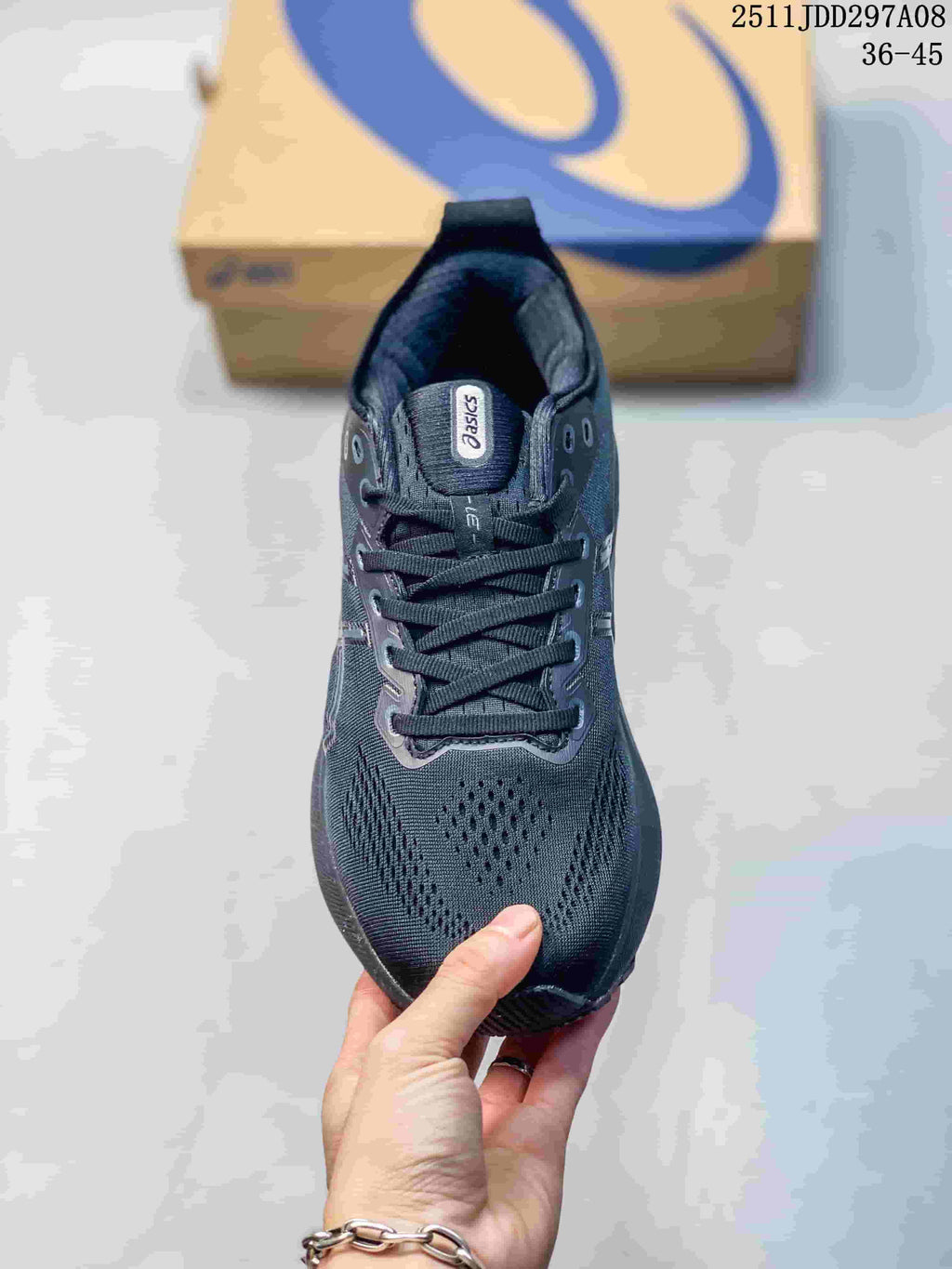 Top view of a dark charcoal lace-up running sneaker with perforated toe panels