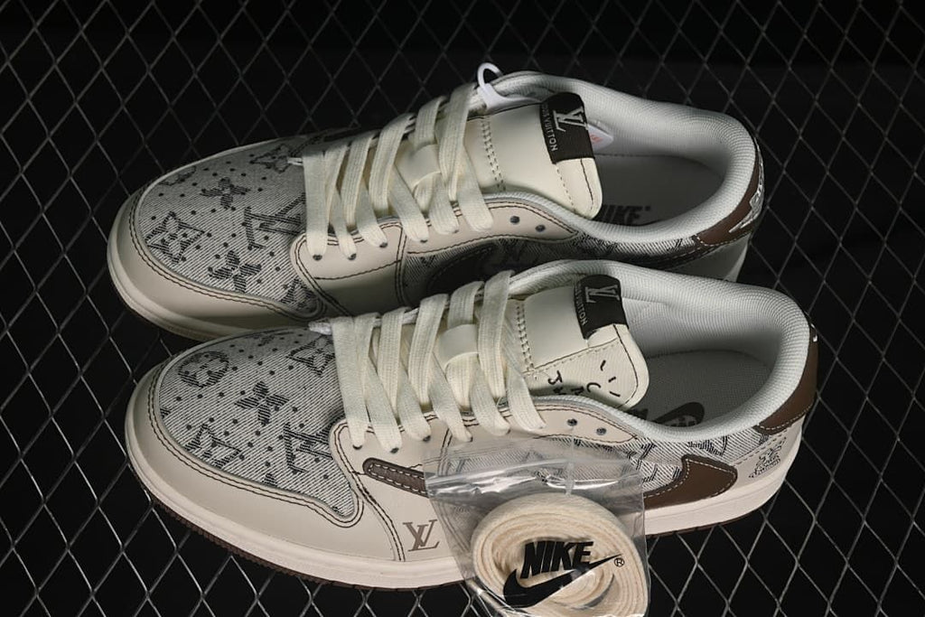 Pair of beige patterned low-top sneakers with white laces and an extra lace set pictured