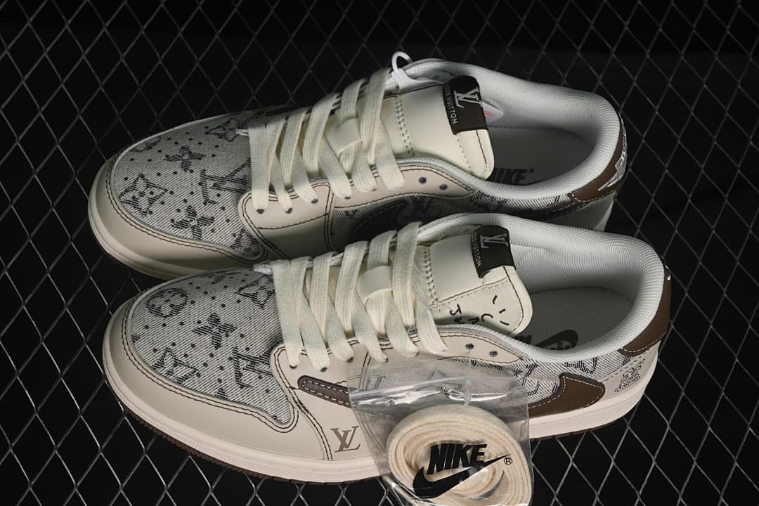 Pair of beige patterned low-top sneakers with white laces and an extra lace set pictured