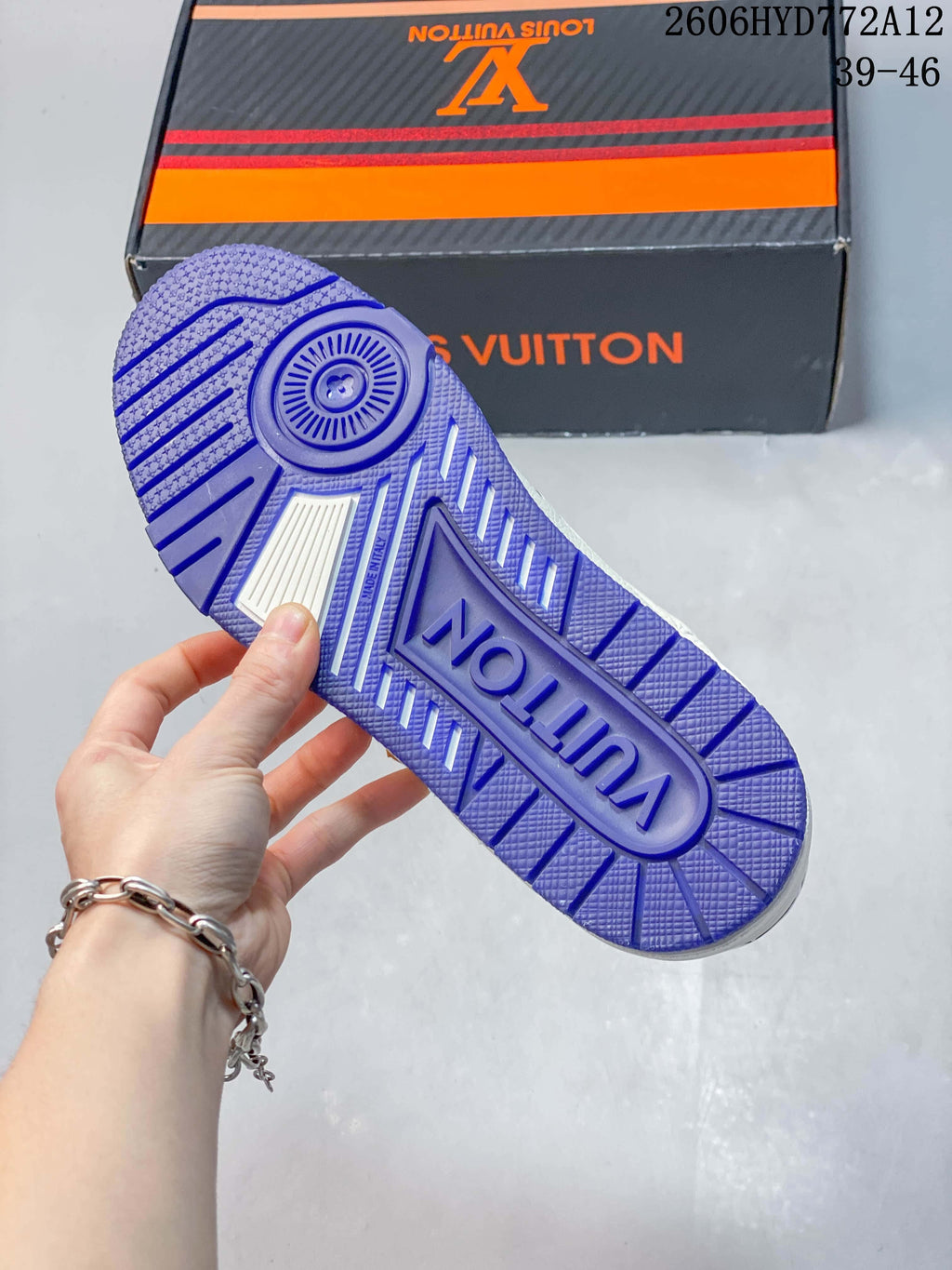 Close-up of the blue patterned outsole of a white sneaker