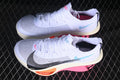 Pair of white running shoes shown from the side