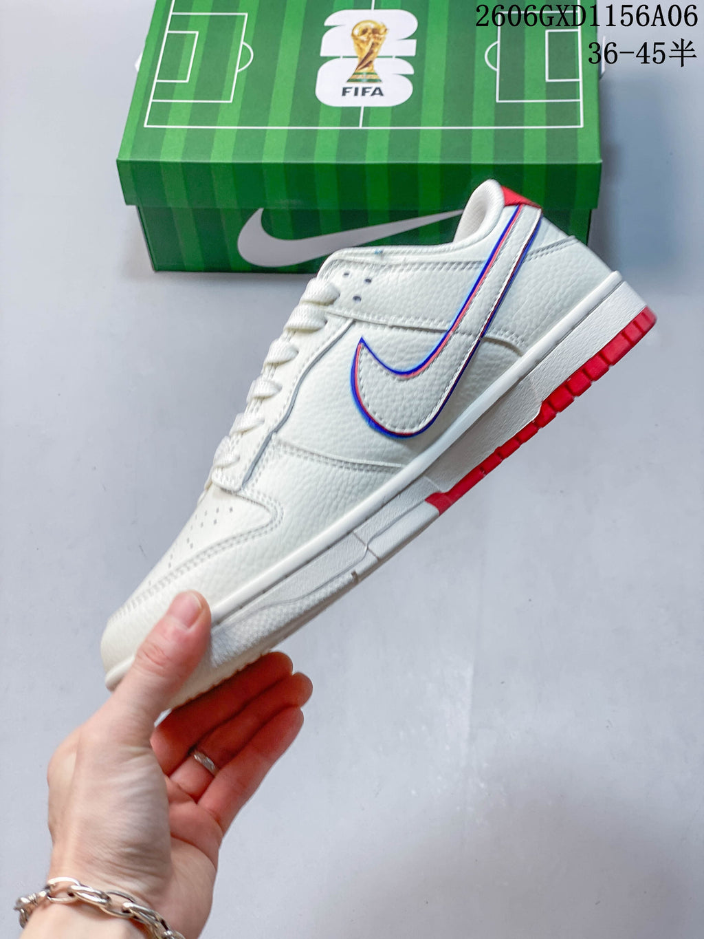 Side view of the off-white low-top sneaker, showing a red-and-blue outlined Swoosh and red outsole details.