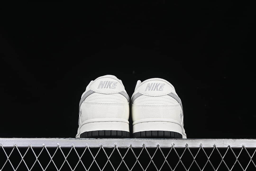 Rear view of both sneakers showing heel panels and black outsoles.