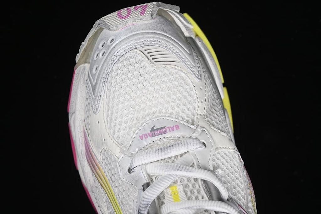 Top view of the sneaker toe, mesh panels, and laces.