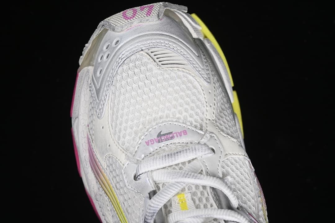 Top view of the sneaker toe, mesh panels, and laces.