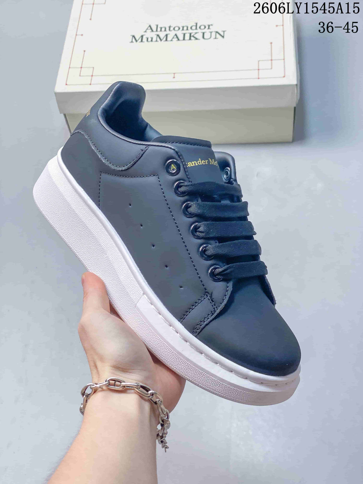 Angled side view of a navy low-top sneaker with perforated panels and a thick white sole.
