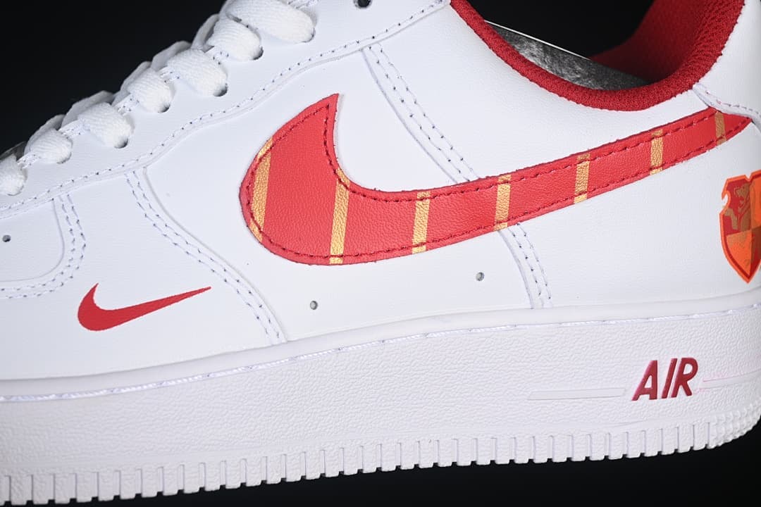 Close-up of the red and gold patterned side Swoosh and heel detail.