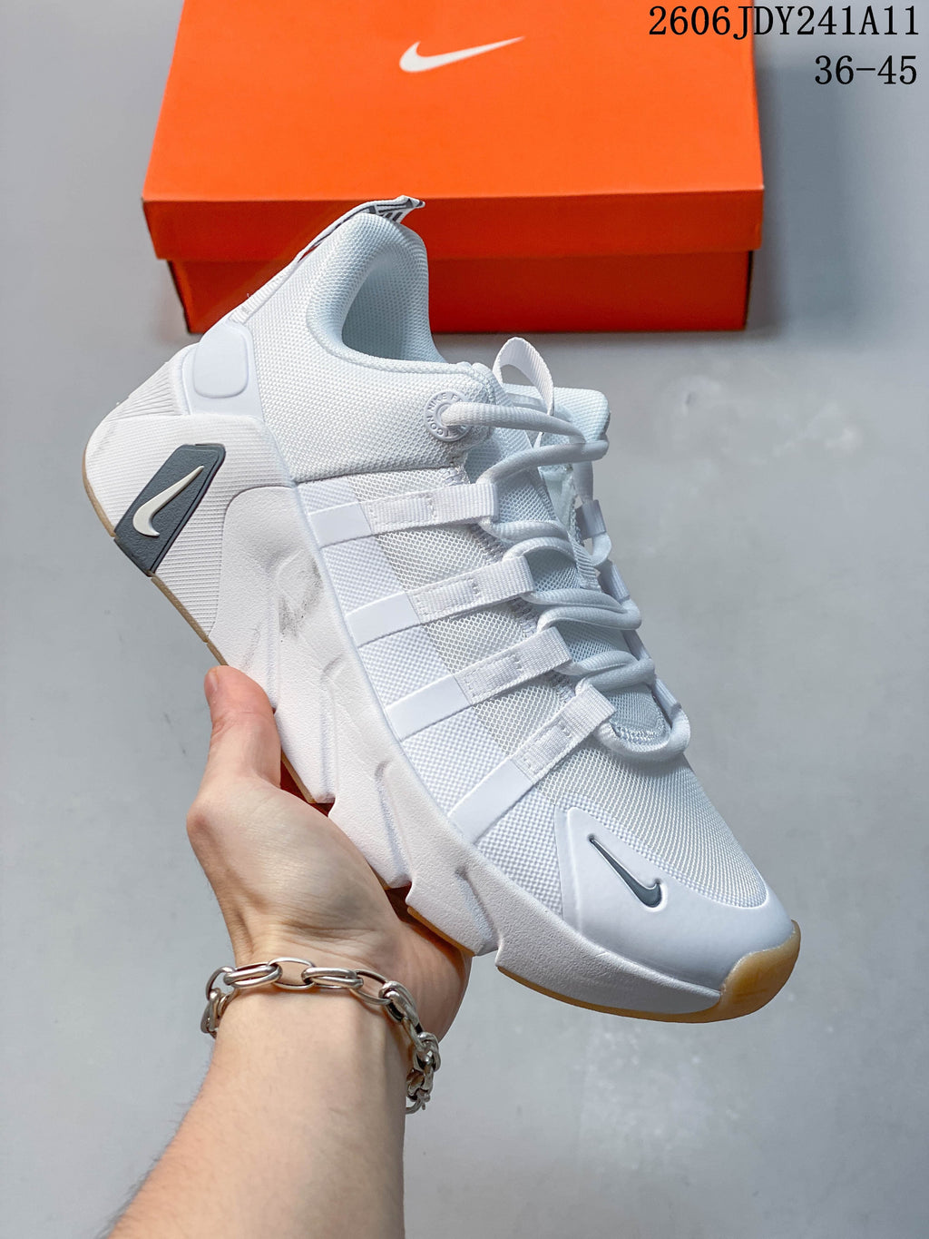 White Nike Free Metcon 7 training shoe with gray accents and a warm-toned outsole detail.