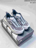 Gray and pale blue Adidas Holo Peak shoes displayed on a shoebox