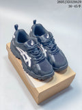 Dark navy Onitsuka Tiger low-top sneakers with light side stripes and a chunky dark outsole.