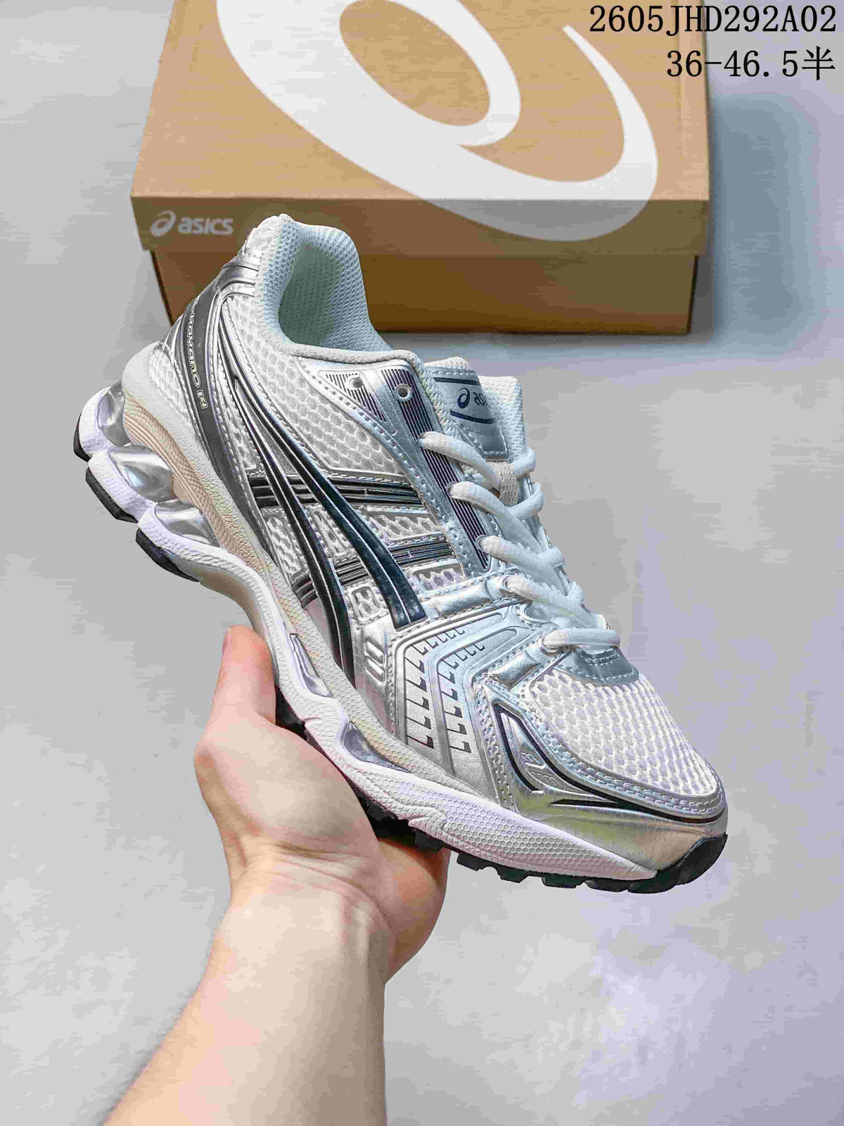 ASICS GEL-KAYANO 14 sneaker in silver and white with dark contrasting details
