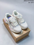 Pair of white and pale neutral ASICS GEL-SD Lyte UB12-S sneakers with silver and purple accents, displayed on a shoebox