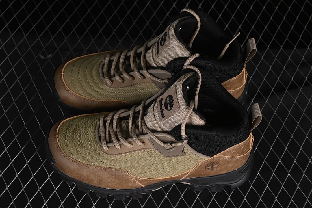 Pair of olive and brown mid-height lace-up boots shown from above and the side.