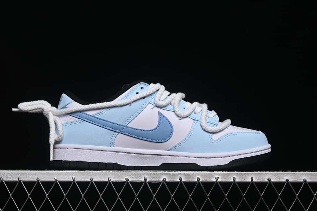 Side profile of a white and light-blue low-top sneaker