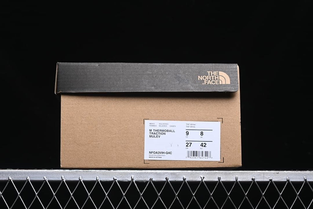 The North Face shoe box label showing the ThermoBall Traction Mule model and sample sizing.