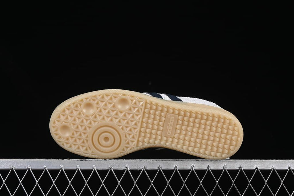 Underside view showing the patterned gum-look outsoles