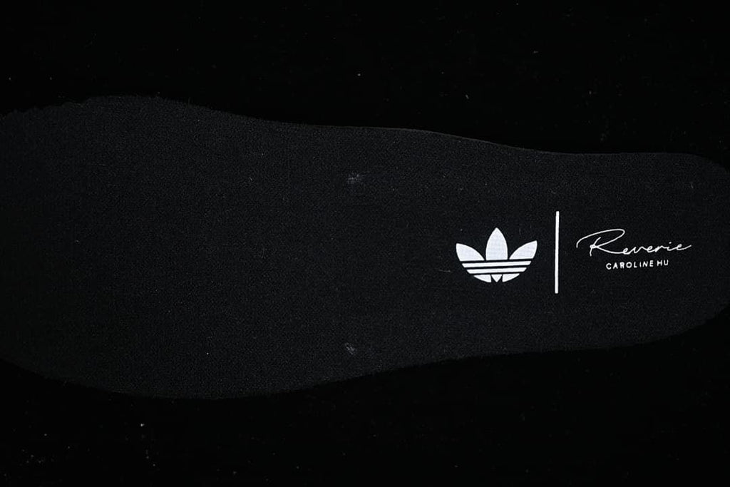 Insole detail with adidas trefoil and collaboration-style lettering visible