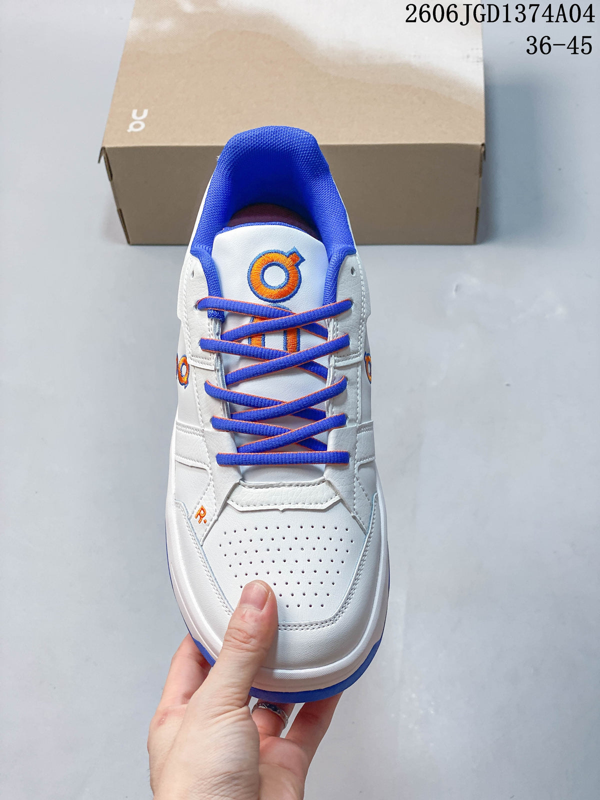 Top view showing the perforated toe, blue laces, and orange accents