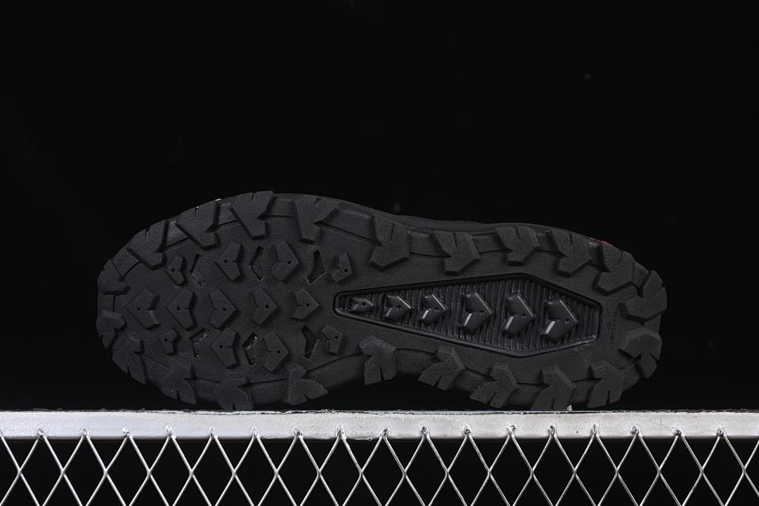 Underside view showing the deeply patterned outsole