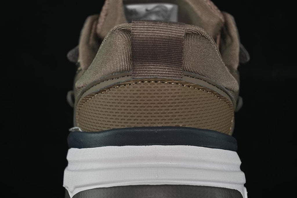 Rear view highlighting the heel pull tab and layered midsole