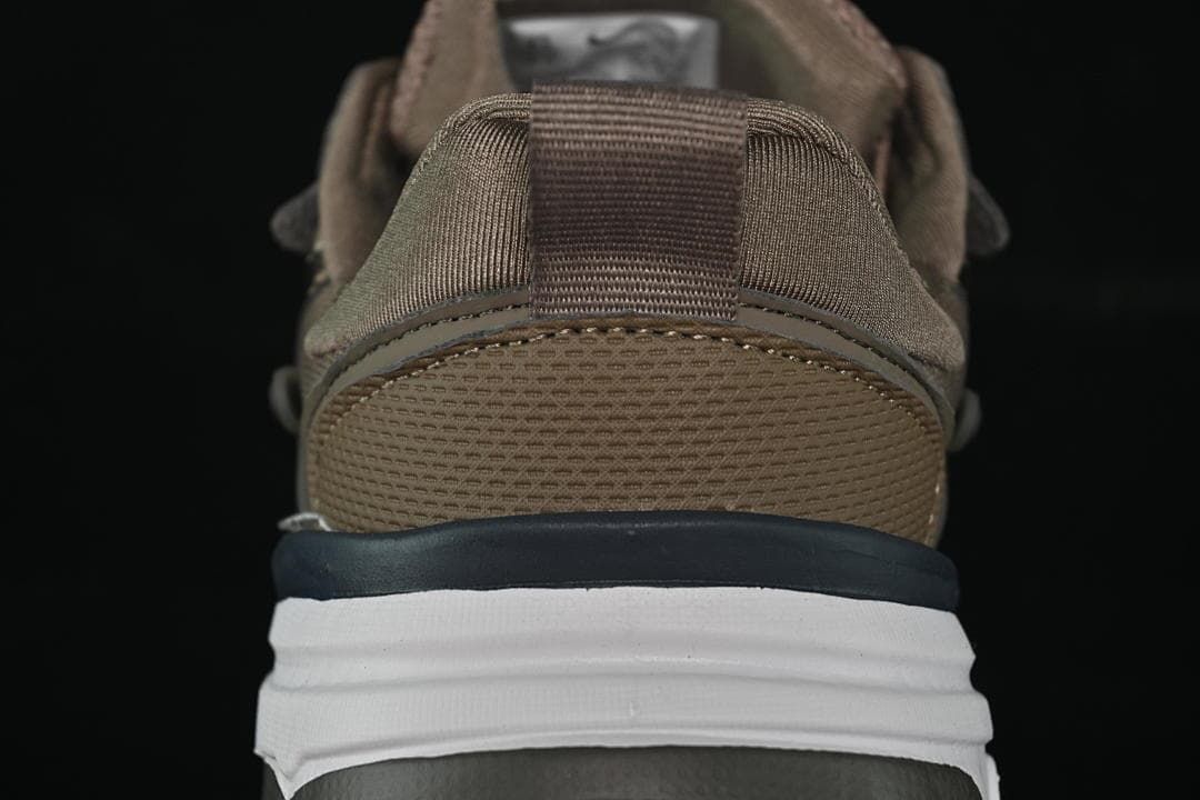 Rear view highlighting the heel pull tab and layered midsole