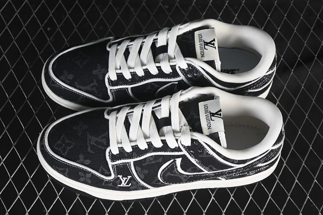 Top view of a pair of black patterned low-top sneakers with white laces and contrasting trim