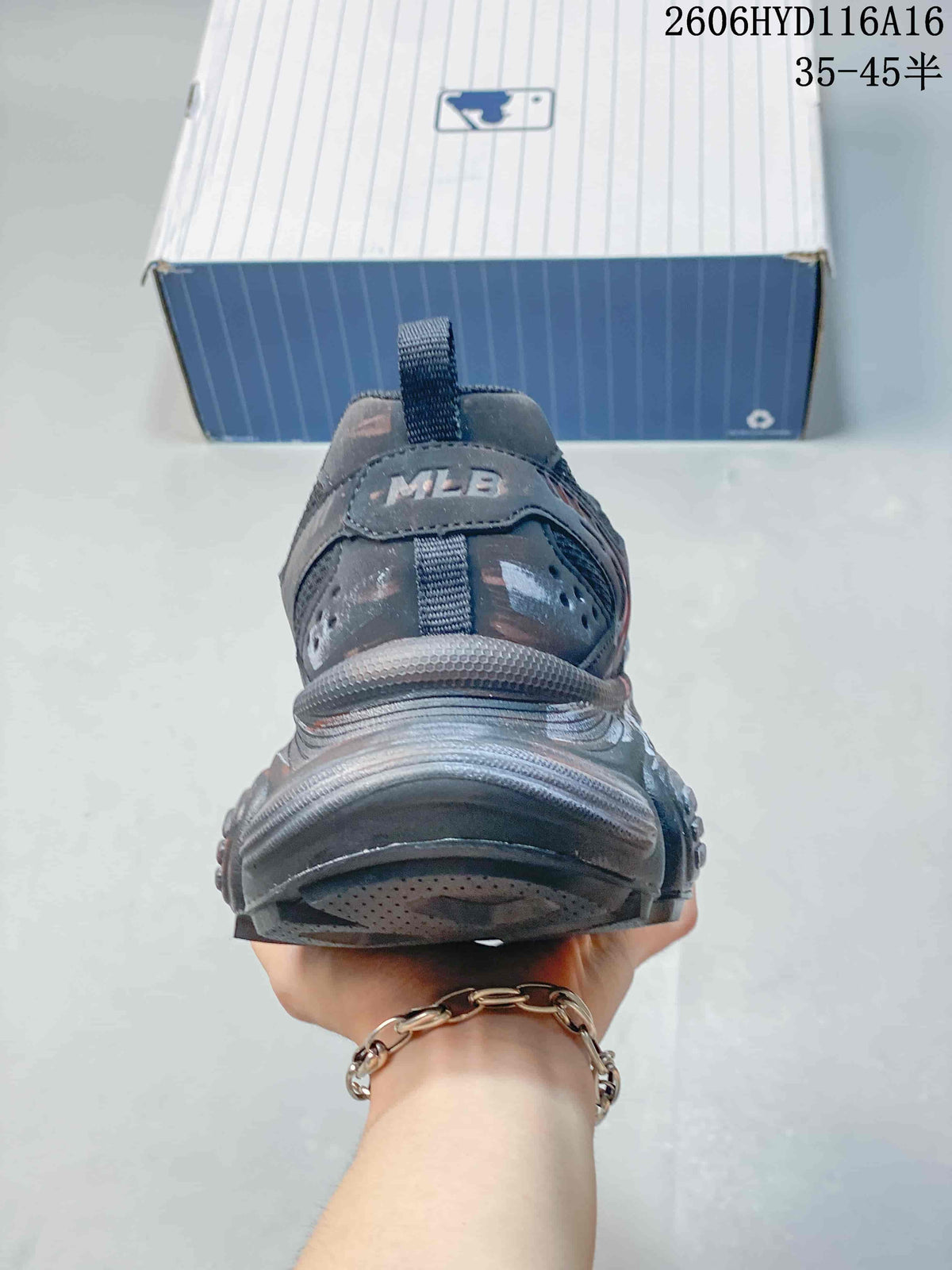 Rear view of a charcoal sneaker showing heel details and pull tab