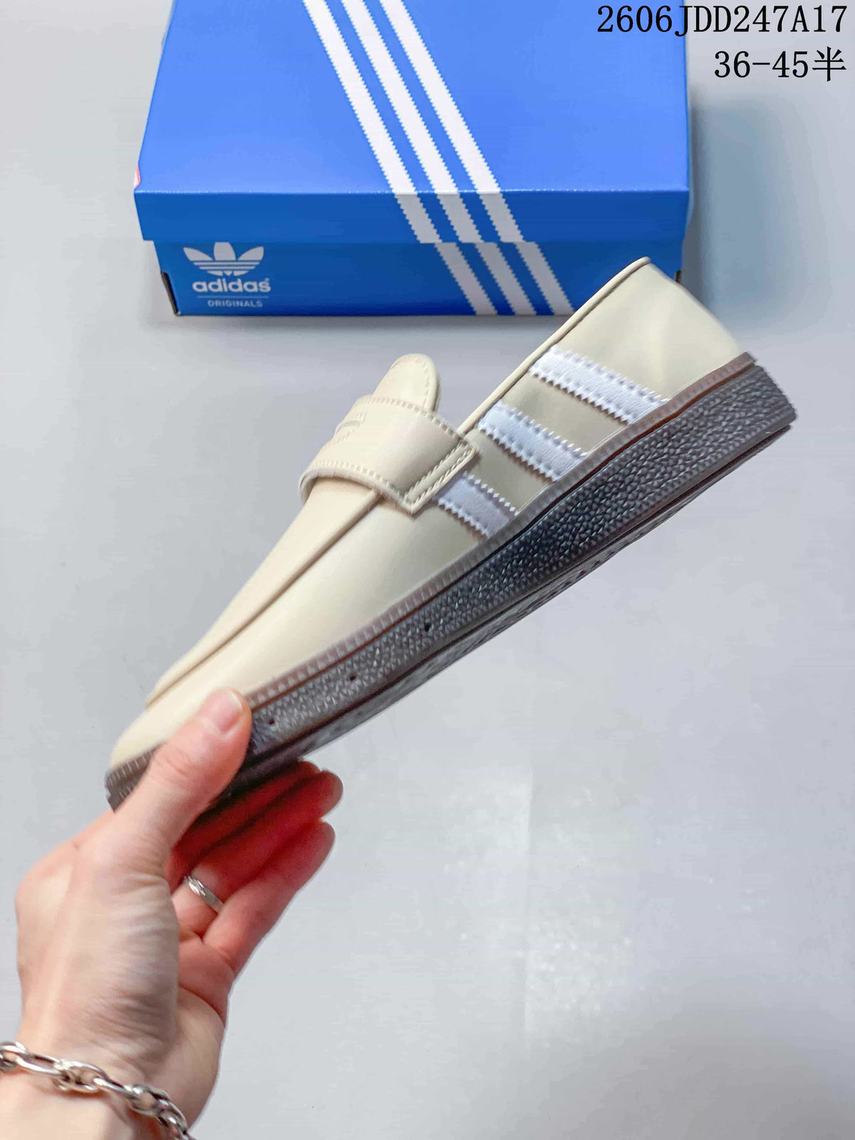 Side profile of a cream adidas Handball Spezial loafer-style shoe with white stripes