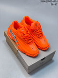 Pair of bright orange Nike NOCTA Hot Step 2 low-top sneakers on a box