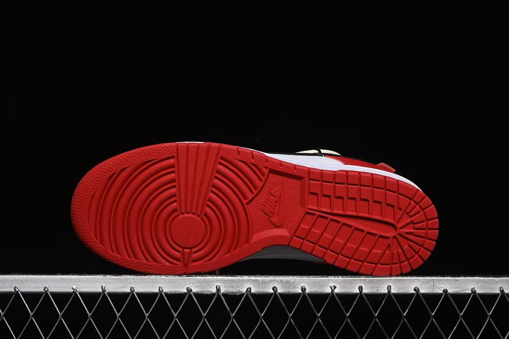 Underside view showing the red patterned outsoles