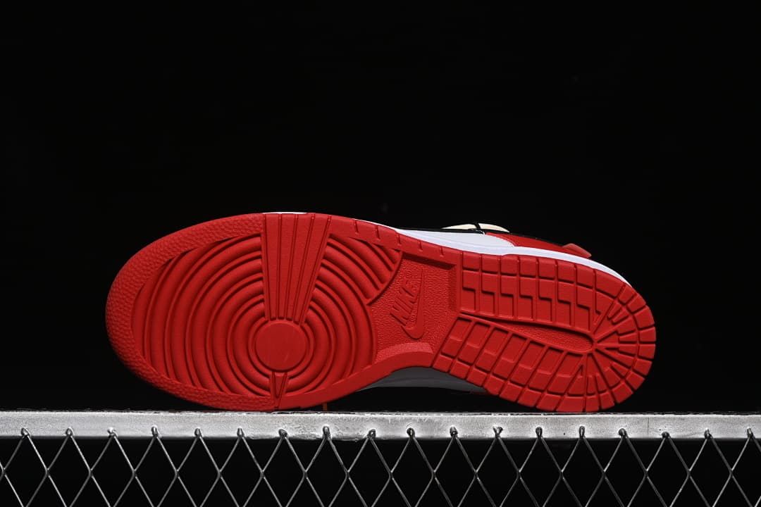 Underside view showing the red patterned outsoles