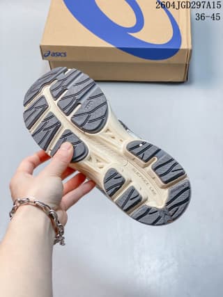 Underside view of the ASICS Gel-Flux CN shoe showing the segmented dark and light outsole pattern.