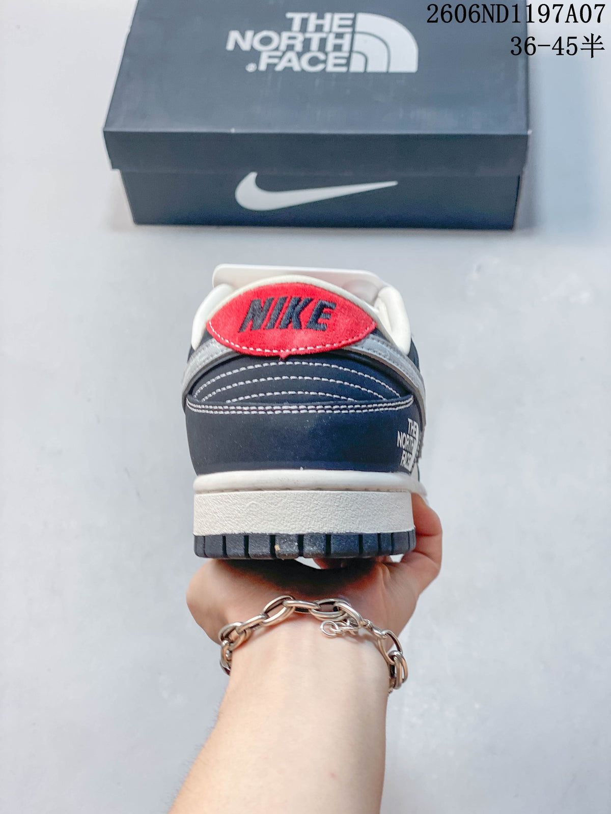 Rear view of the sneaker with a red Nike heel detail and navy panels