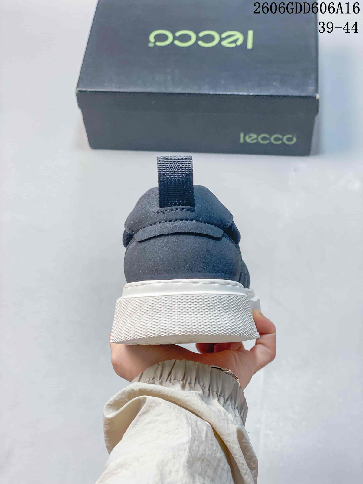 Rear view of a navy slip-on sneaker showing the heel pull tab and white sole