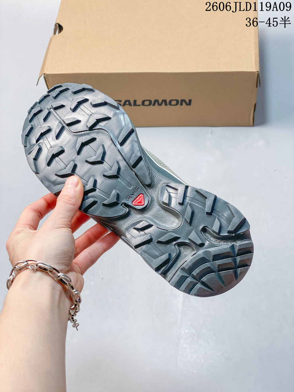 Close-up of the Salomon XT-6 FT lugged outsole and tread.