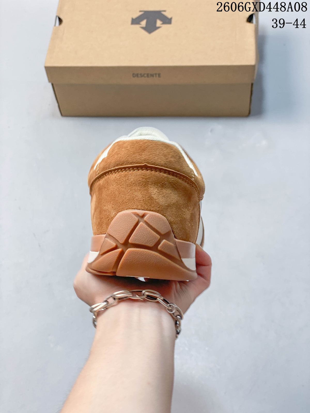 Rear view showing the brown heel panels and outsole of the sneaker