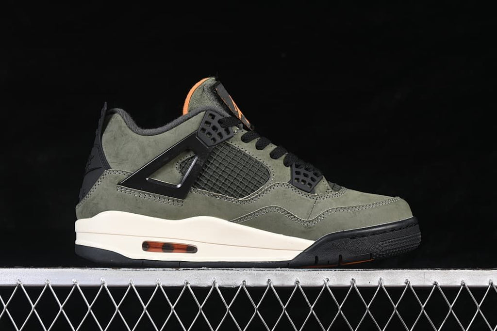 Side profile showing the olive upper, black side cage, cream midsole, and orange heel window